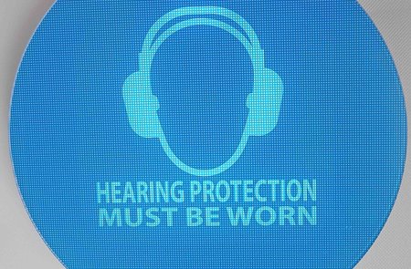 Weatherproof noise activated warning signs