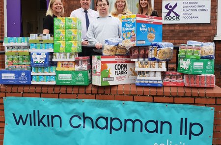 Arms full of shopping handed to grateful food bank operator, after raiders strike for the second time.