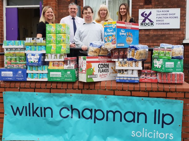 Arms full of shopping handed to grateful food bank operator, after raiders strike for the second time.
