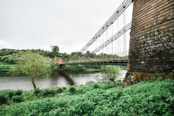 Spencer Group to begin rebuild of historic chain suspension bridge