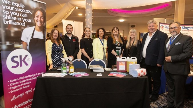 Sylvester Keal with dignitaries on their stand 