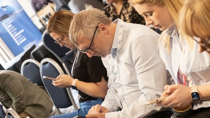 Visitors taking part in AI challenges at last year's event 